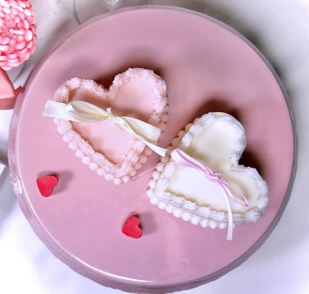 Two hearts cakes candles